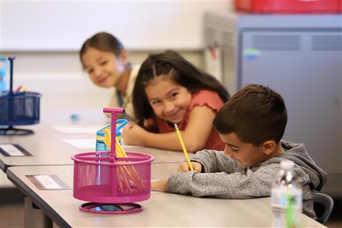 Stolley Park students smiling at their desks